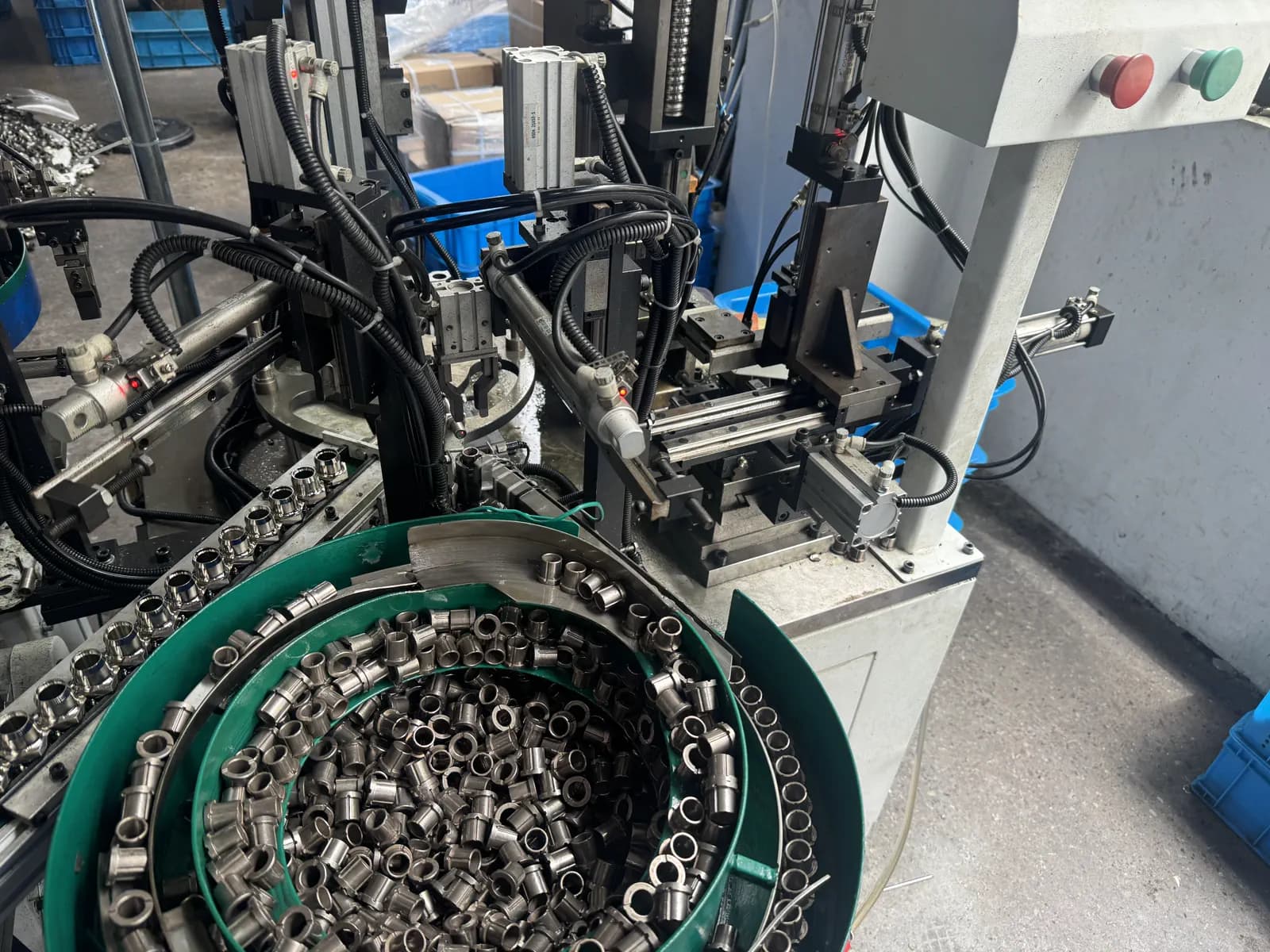 Real automated feeding equipment moving machined spindle components through a supplier production cell